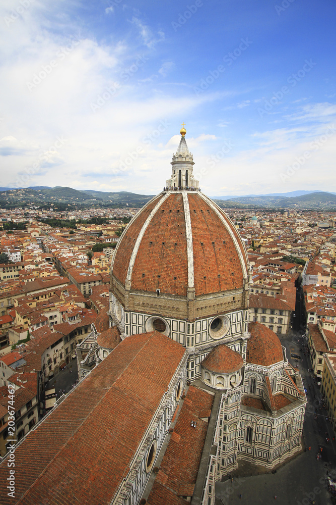 Basilica di Santa Maria del Fiore and city panorama, aerial view, Florence, Tuscany, Italy; roofs, buildings and dome.