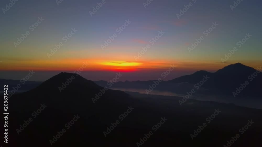 Amazing view of colorful sunrise at silhouette volcano Batur drone footage Amazing view of colorful sunrise at silhouette volcano Batur drone footage