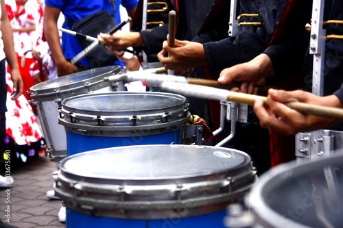 Marching band's drummers playing the drums