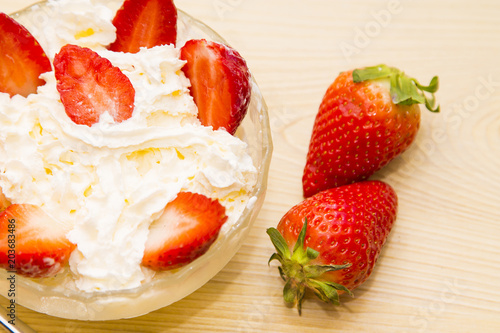 Fototapeta Naklejka Na Ścianę i Meble -  glass bowl of strawberries with cream