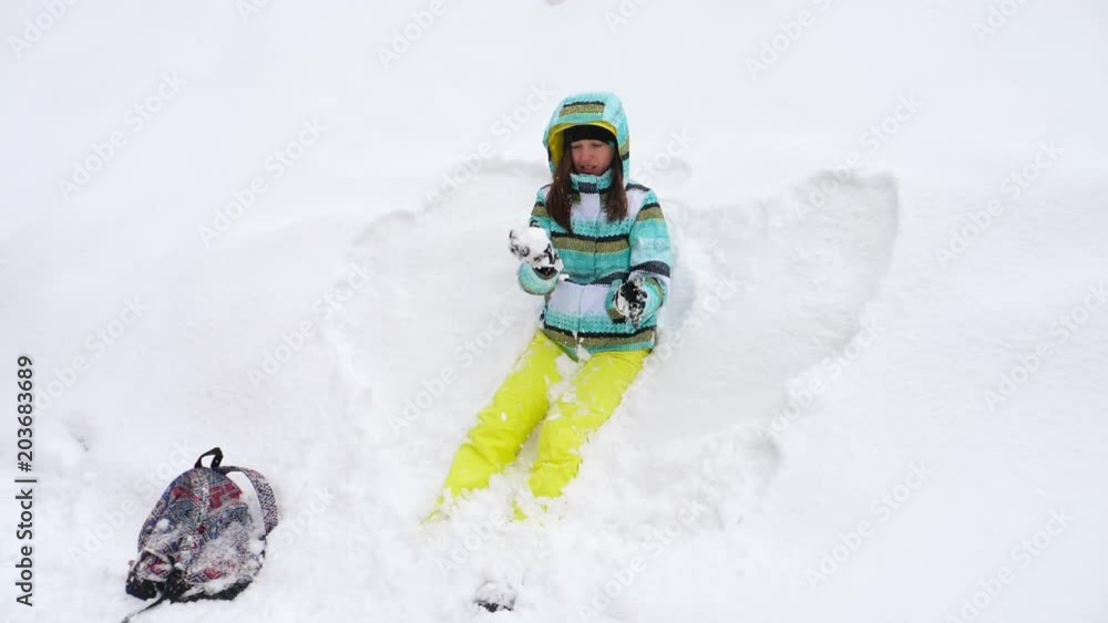 Mom with a three-year-old daughter play snowballs Mom with a three-year-old daughter play snowballs