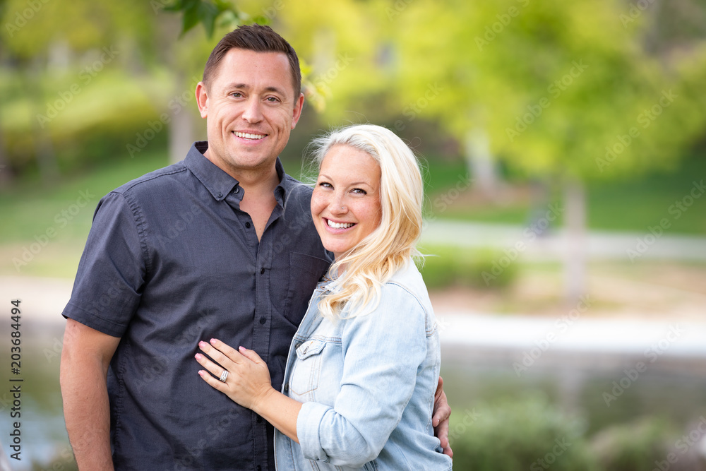 Young Caucasian Couple Portrait In The Park Young Caucasian Couple Portrait In The Park