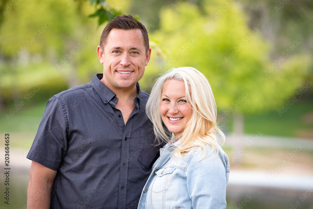 Young Caucasian Couple Portrait In The Park Young Caucasian Couple Portrait In The Park