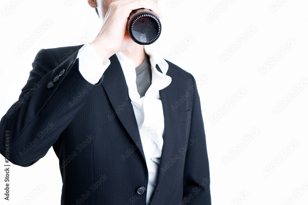 Businessman holding a beer bottle on isolated white background. Businessman holding a beer bottle on isolated white background.
