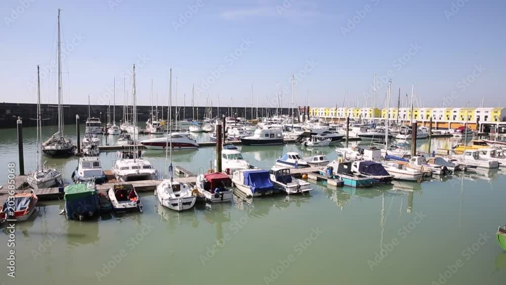 Brighton marina East Sussex England UK with boast and apartments pan 