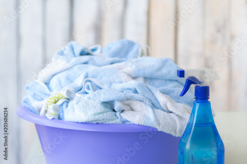 Clean wet laundry pile inside plastic basket