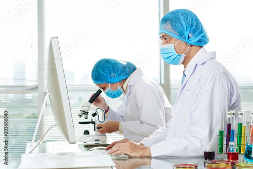 Microbiologists Working at Modern Lab