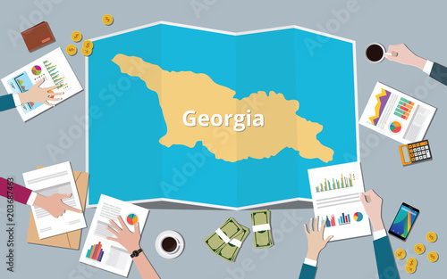 georgia country growth nation team discuss with fold maps view from top
