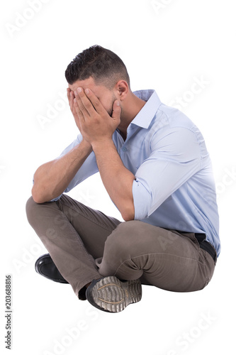 sad man covers his face
