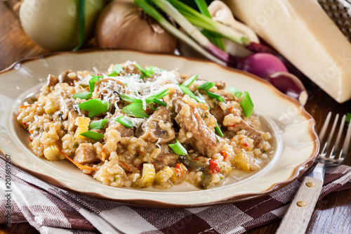 Risotto with champignon mushrooms, pork and parmesan