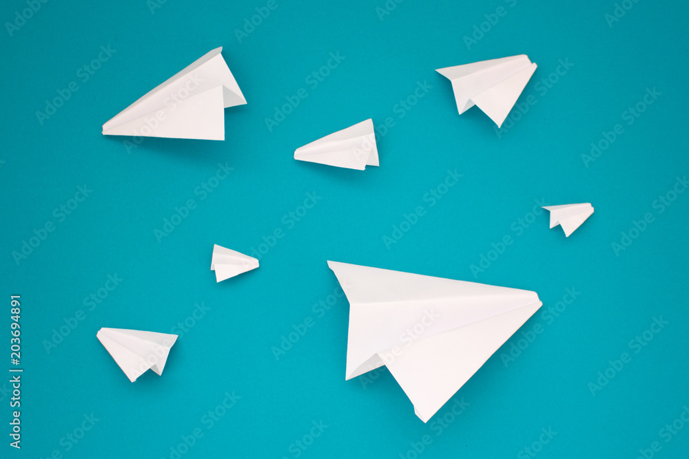 White paper planes on a blue background. Telegram symbol White paper planes on a blue background. Telegram symbol