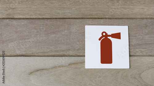 fire extiguisher sign on wood wall with space for adding text on the left side
