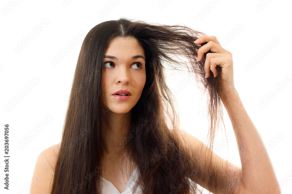 Young woman with well-groomed combed and problem unkempt hair. White  background close up Photos | Adobe Stock