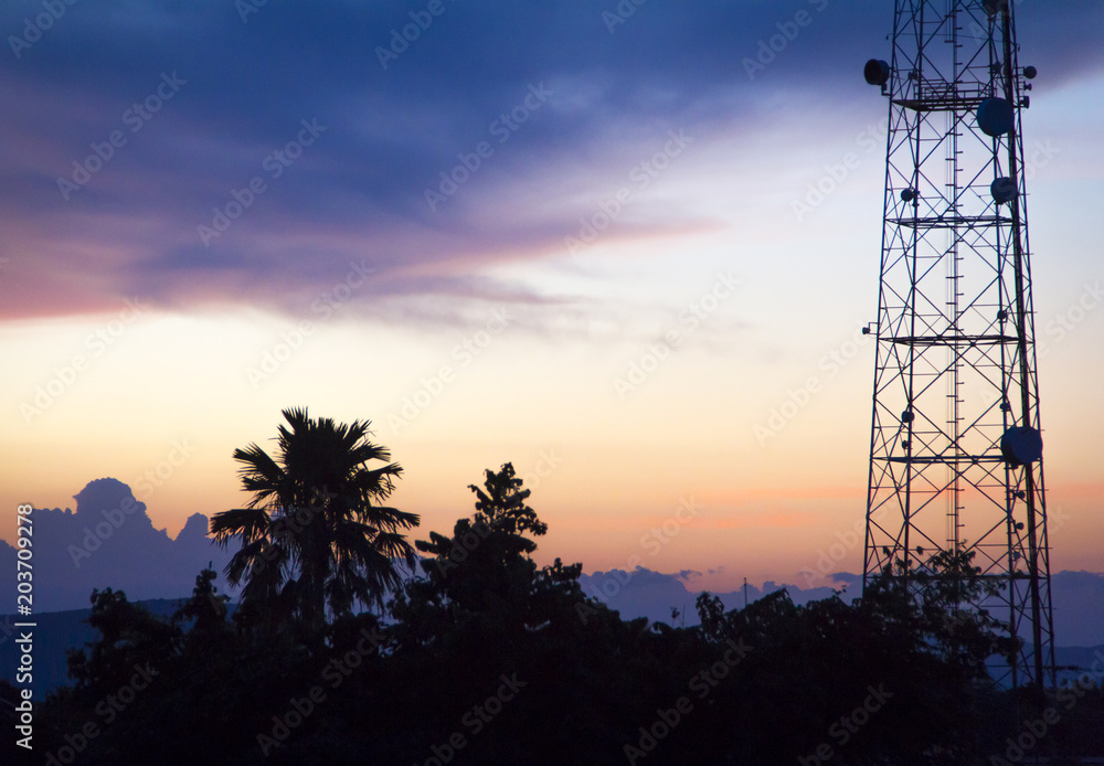 evening landscape with twilights and communications tower