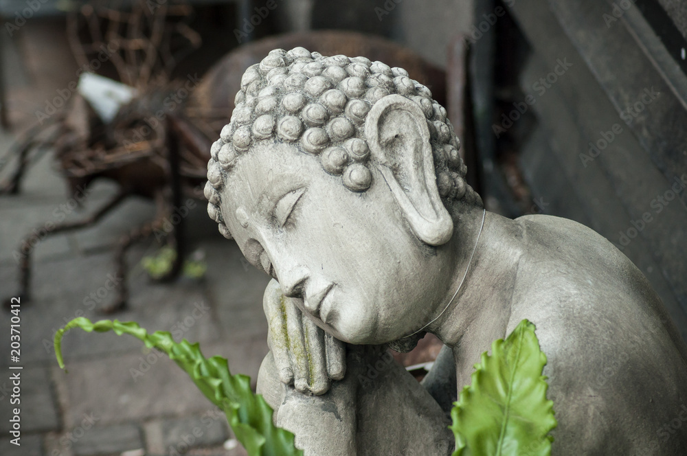 closeup of buddha statue at florist in the street closeup of buddha statue at florist in the street