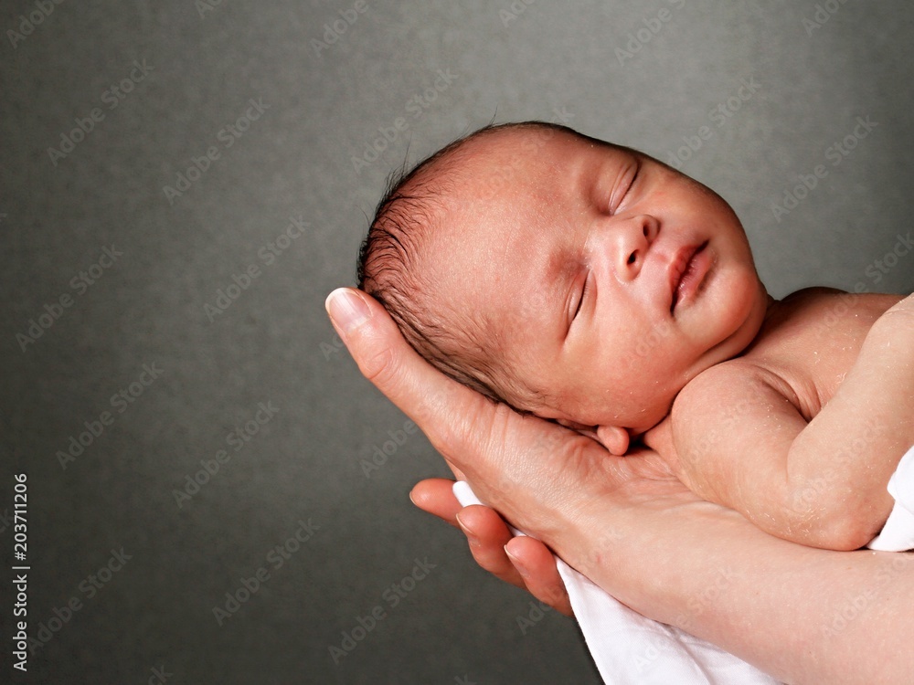 baby in mothers arms Stock Photo Adobe Stock