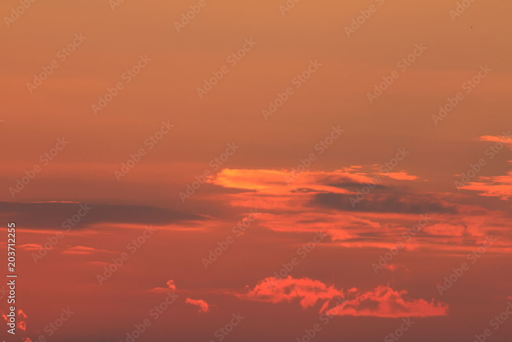 Oragne Clouds reflect sunlight In evening