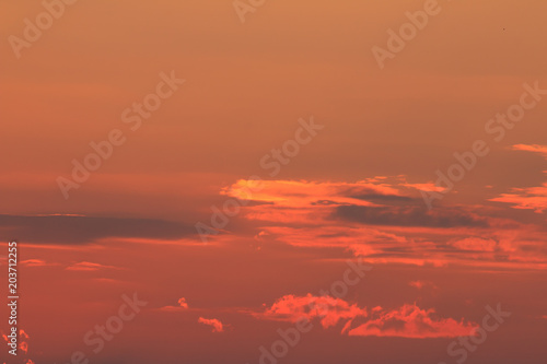 Oragne Clouds reflect sunlight In evening