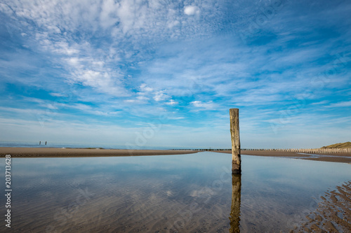 Beautiful Lonely Beach Of Domburg With Waterreflections And Groyne Pillars - Zeeland