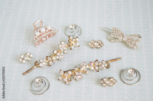 Girl accessories near the casket. Hairpins, earrings, rings are the treasures of a little girl. Children's costume jewelery