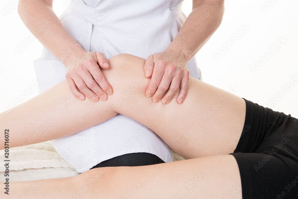 Beautiful woman having massage leg at spa salon Beautiful woman having massage leg at spa salon