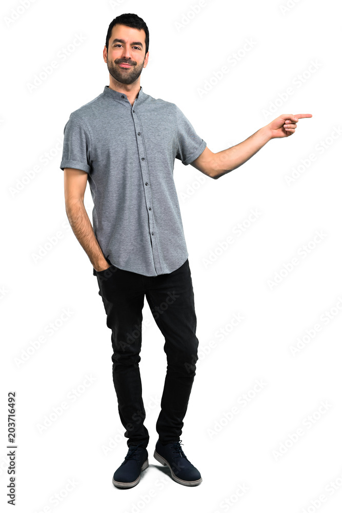 Handsome man pointing to the lateral Handsome man pointing to the lateral