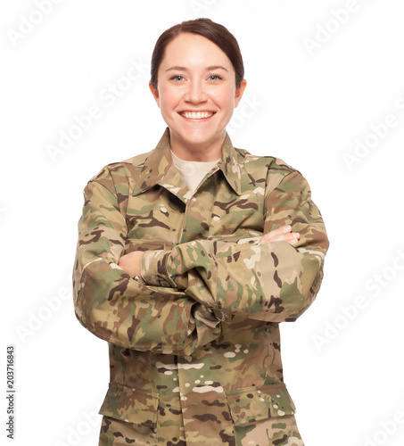 Soldier with arms crossed on white background.
