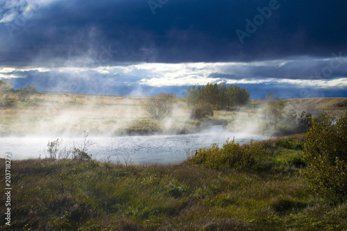 Deildartunguhver hot spring in Reykholtsdalur, Iceland. The most powerful thermal spring in Europe which water used for central heating. Nearby greenhouses use the geothermal heat to grow vegetables.