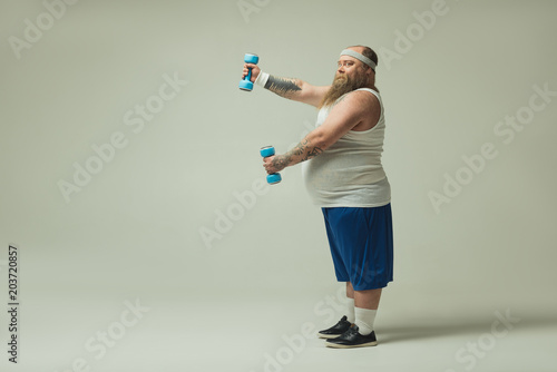 Man exercising with dumbbells 