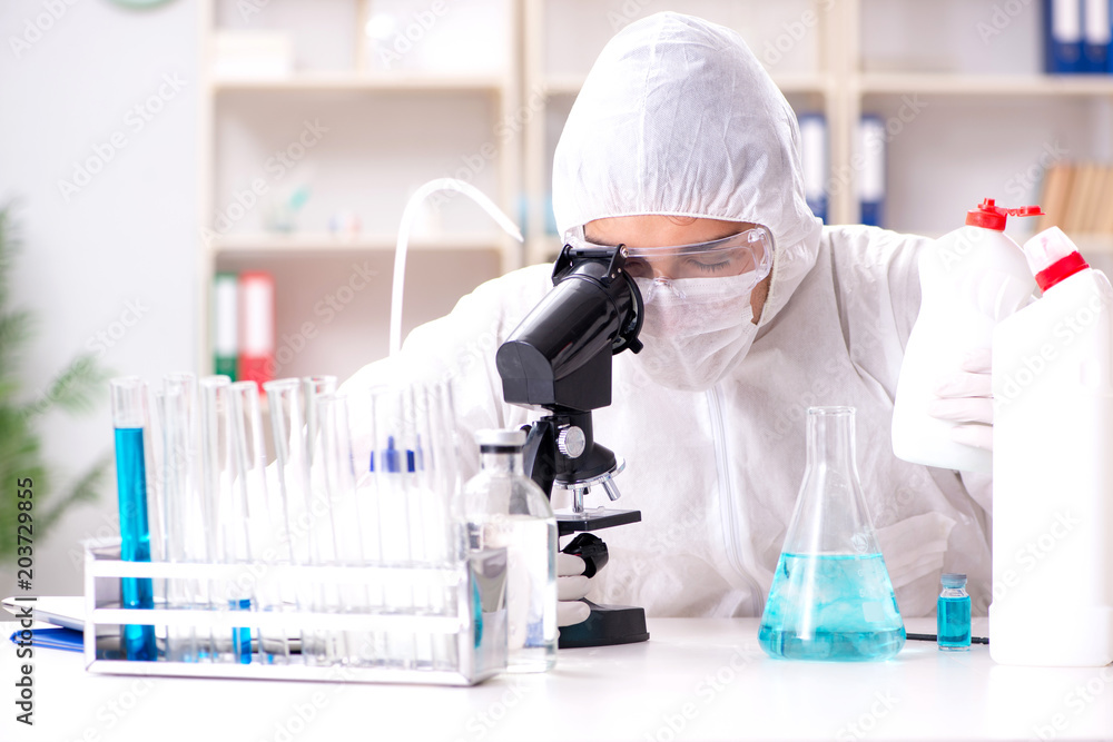 Chemist checking the quality of bathroom supplies Chemist checking the quality of bathroom supplies
