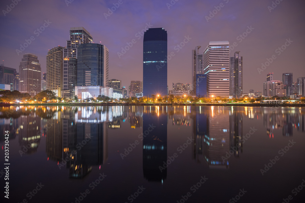scenic of early twilight morning cityscape and mirror on water