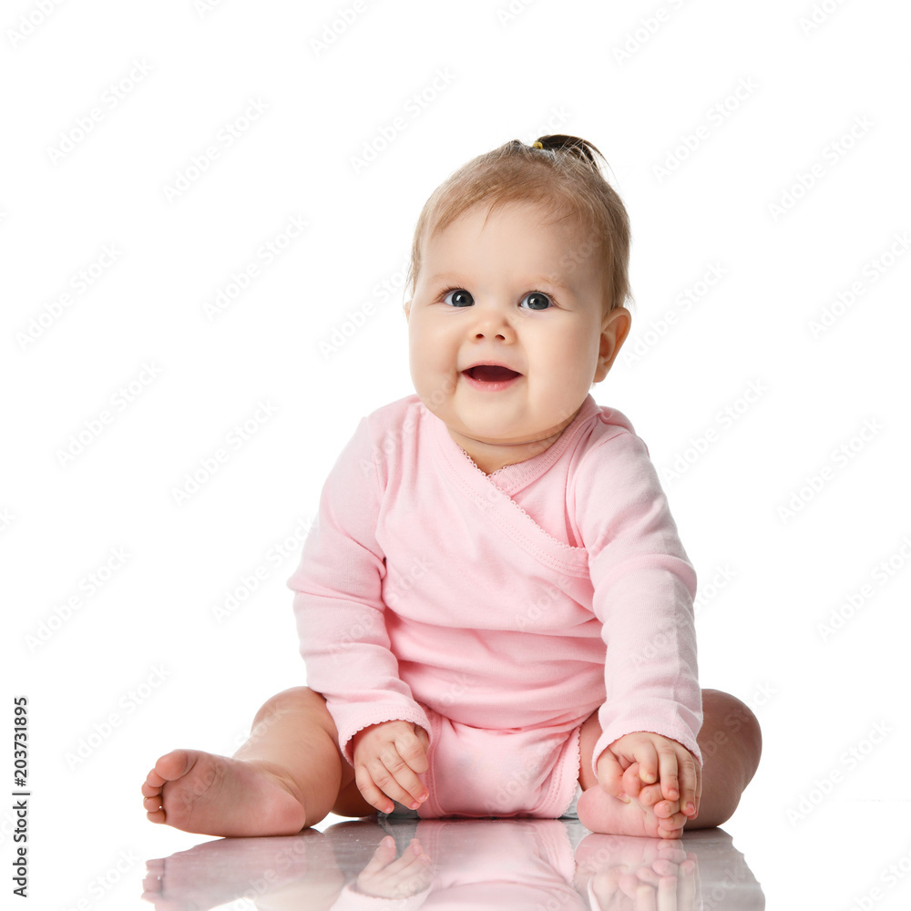 8 month infant child baby girl toddler sitting in pink shirt isolated on a white 8 month infant child baby girl toddler sitting in pink shirt isolated on a white