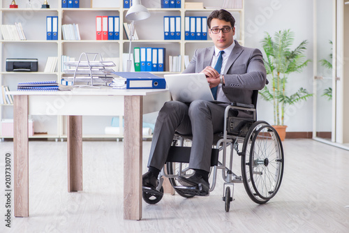 Disabled businessman working in the office © Elnur
