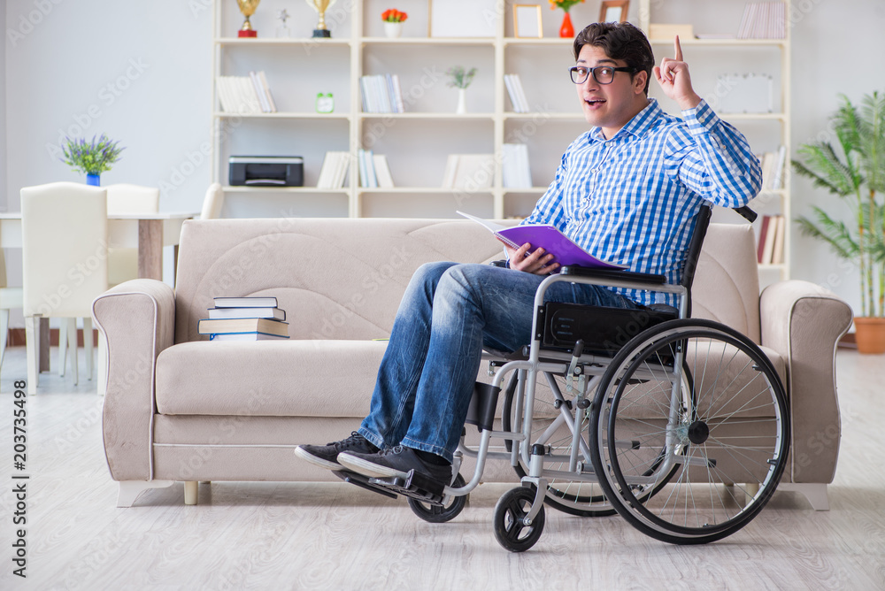 Young student on wheelchair in disability concept Young student on wheelchair in disability concept