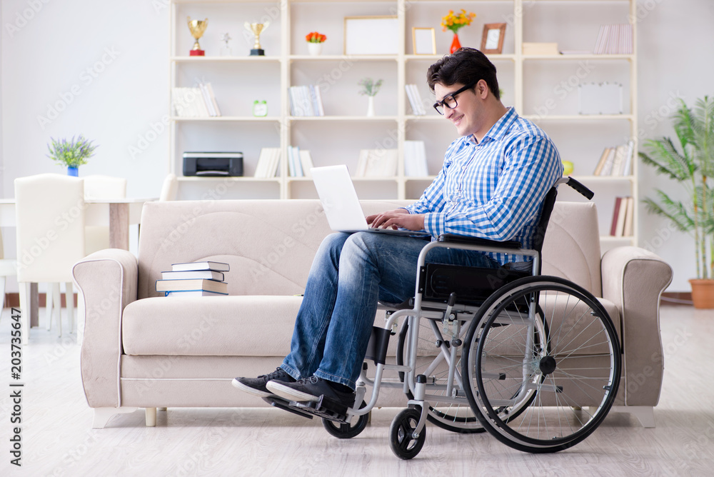 Young student on wheelchair in disability concept Young student on wheelchair in disability concept