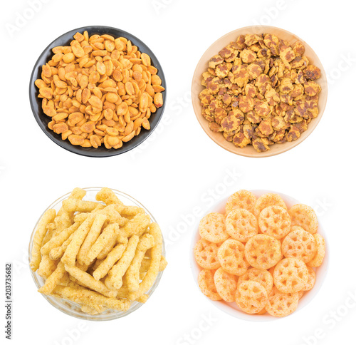 Indian Snack Food Collection Masala Peanuts, Chana Jor Garam, Crunchy Kurkure or Salty Wheels Snack isolated on white background