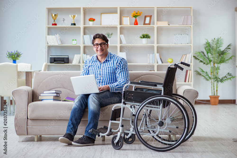 Young student on wheelchair in disability concept Young student on wheelchair in disability concept