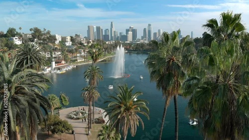 Los Angeles Aerial Shot of Downtown Skyline over Palm Trees and Lake in Echo Park California USA