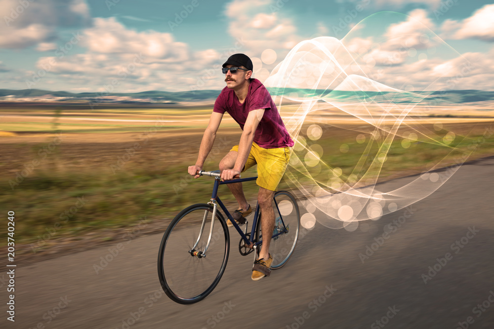 Fototapeta premium Gorgeous biker in the nature going somewhere with ethereal concept