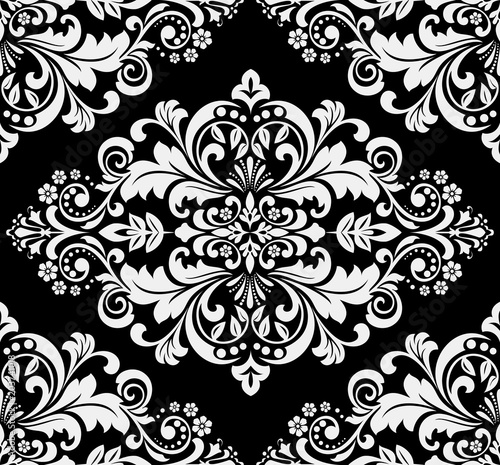 Wallpaper in the style of Baroque. A seamless vector background. Black and grey floral ornament. Graphic pattern for fabric, wallpaper, packaging. Ornate Damask flower ornament