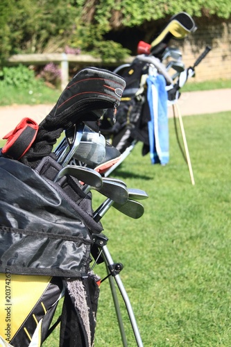 golf clubs with green background