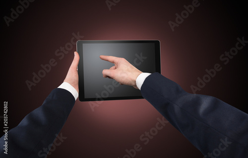 Wallpaper Mural Hand using tablet with no concept and empty space
 Torontodigital.ca