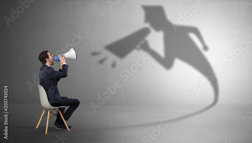 Quadro em tela Small businessman staying and offering stuffs to his bossy yelling shadow