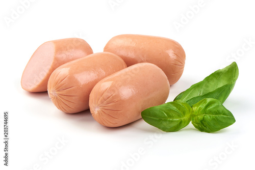 Fresh Munich sausages with basil, isolated on white background.