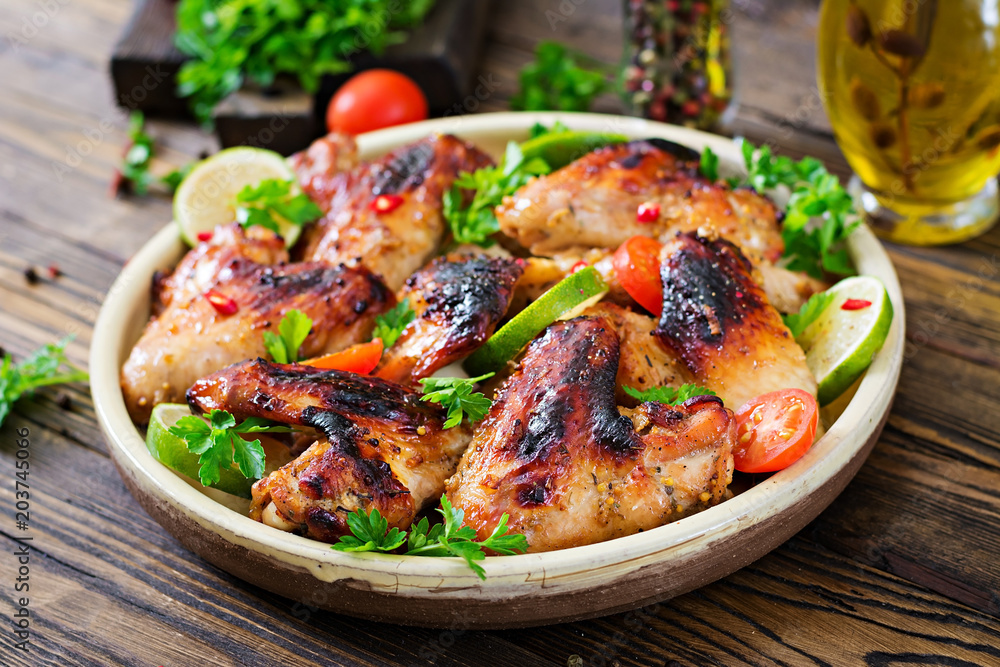 Chicken wings of barbecue in sweetly sour sauce. Picnic. Summer menu. Tasty food Chicken wings of barbecue in sweetly sour sauce. Picnic. Summer menu. Tasty food