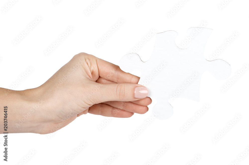 Piece of puzzle with hand, isolated on white background Piece of puzzle with hand, isolated on white background