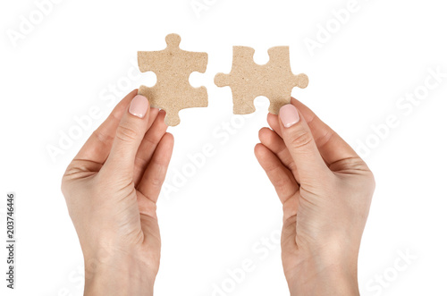 Piece of puzzle with hand, isolated on white background