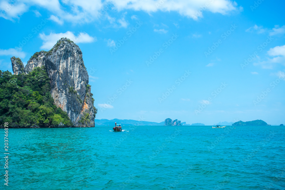 Longtail boats in the sea near Hong island in Krabi Province Thailand.