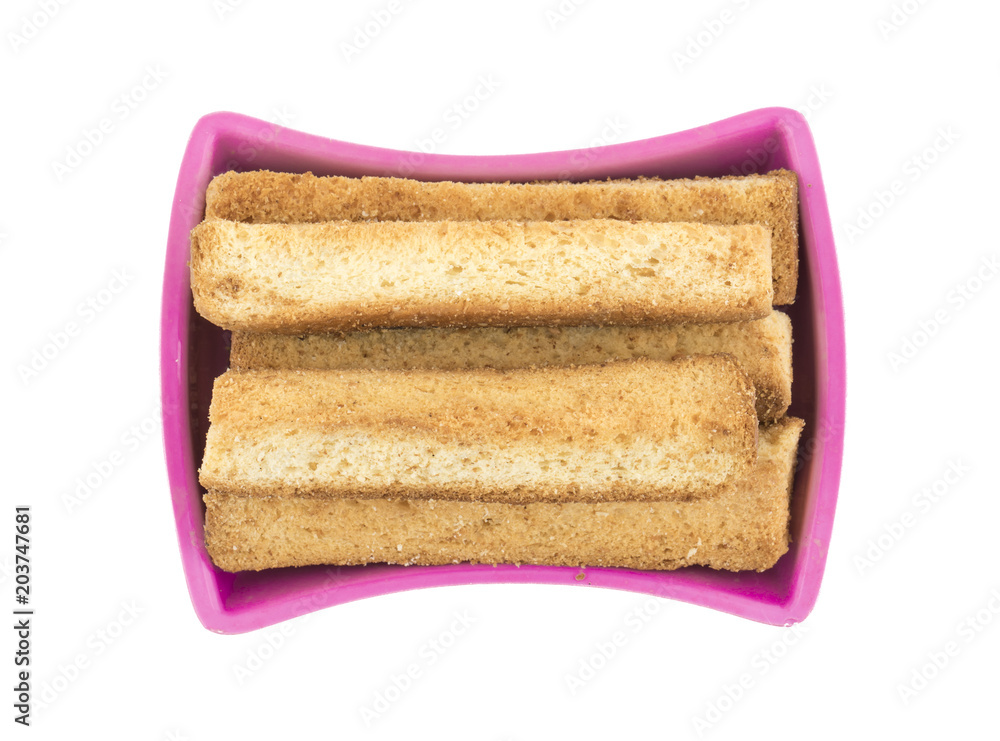 Fototapeta premium Indian Bakery Food Tea Time Sweet Dry Toast Snack Also Know As Indian Toast Snack, Toasted, Bread, Long Toast, Mawa Toast isolated on White Background