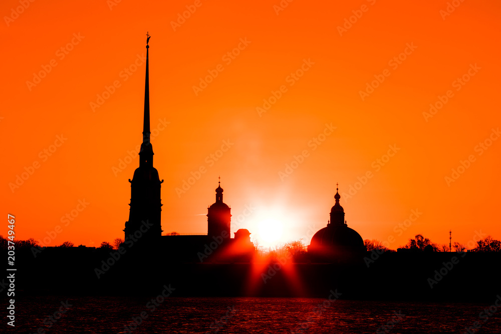 Peter and Paul Fortress of St. Petersburg, Russia in the rays of setting sun. The Peter and Paul Fortress is the original citadel  founded by Peter the Great in 1703 and built to Trezzini's designs